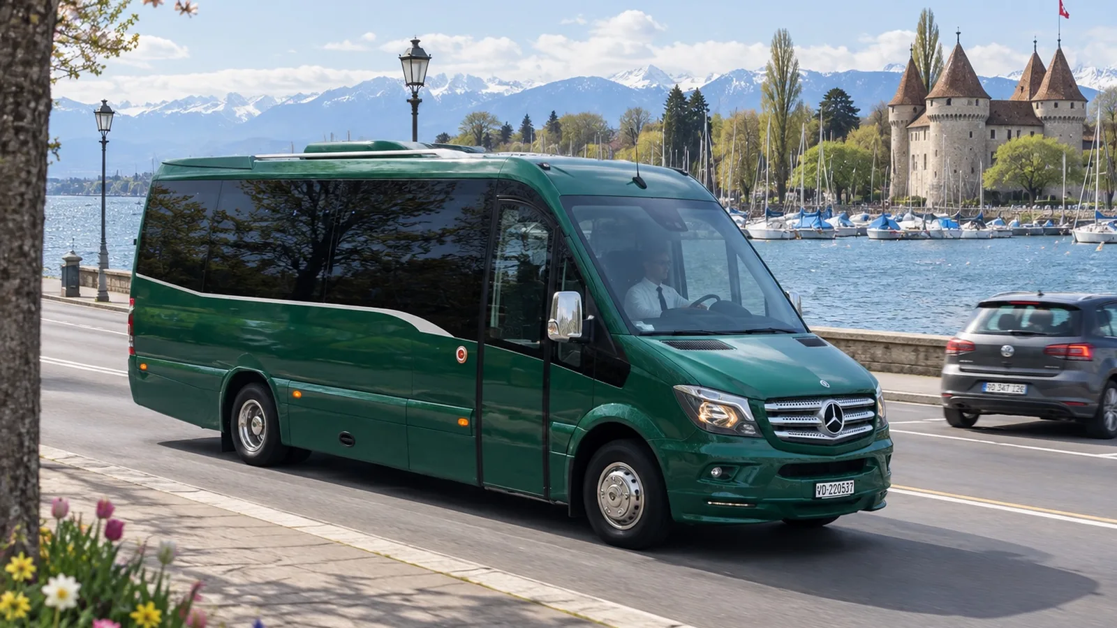 Voyages Stevic Sàrl Mercedes-Benz Travego coach driving through Lausanne, the cathedral behind