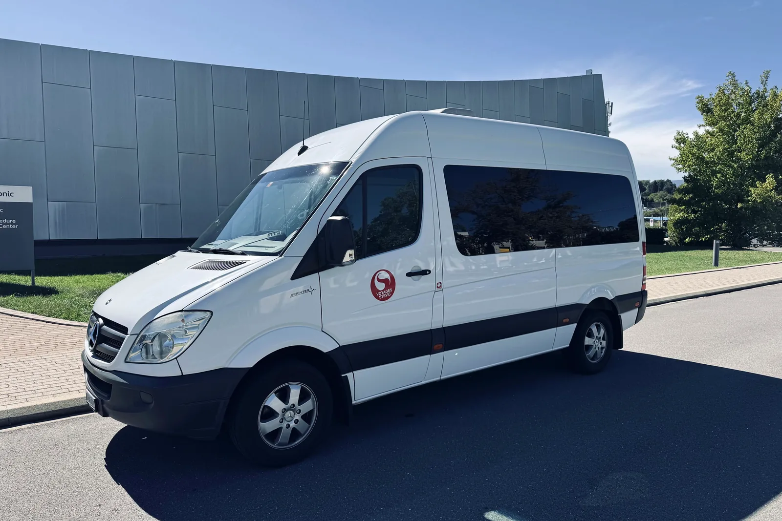 Voyages Stevic Sàrl 13-seat Mercedes-Benz Sprinter minibus, three-quarter front view