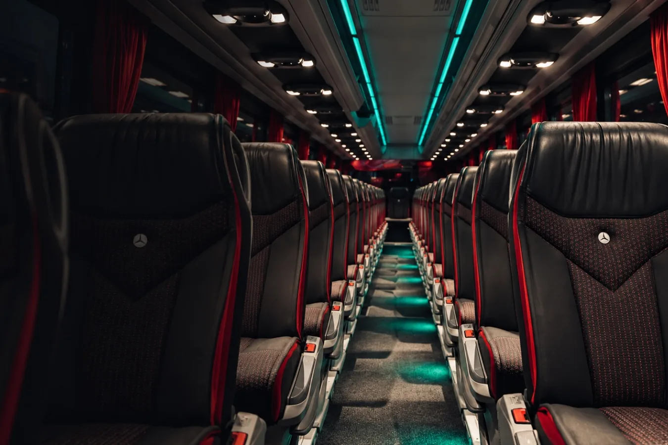 Central aisle of the Travego coach, black leather Luxline upholstery and ambient lighting