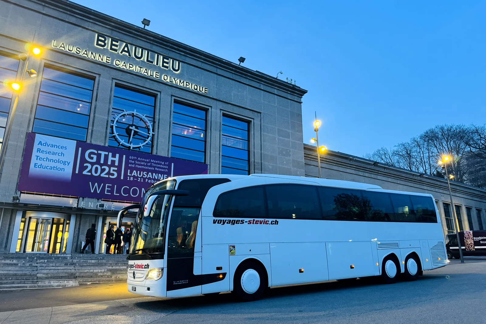 Voyages Stevic Sàrl coach in front of the Palais de Beaulieu in Lausanne